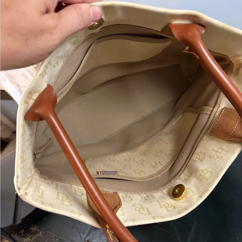 Dooney and Bourke Beige Canvas and Leather Signature Tassel Tote Handbag